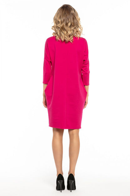 Side view of the Tessita loose-fitting daydress, highlighting its graceful silhouette and sophisticated design.