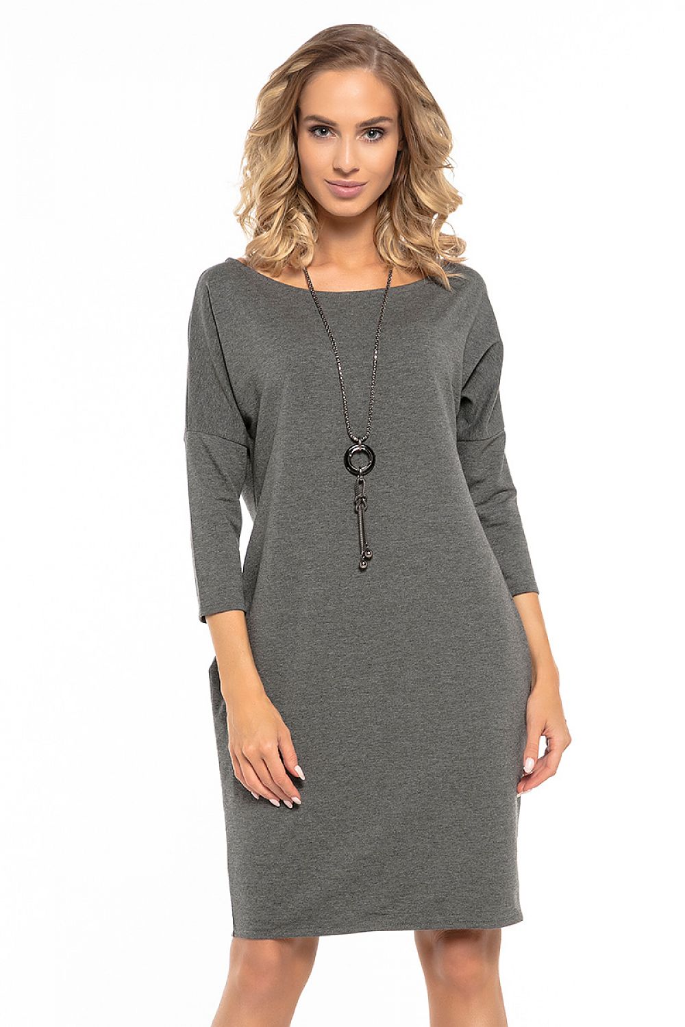 Model wearing the elegant loose-fitting daydress by Tessita, beautifully demonstrating its flattering fit and stylish boat neckline.