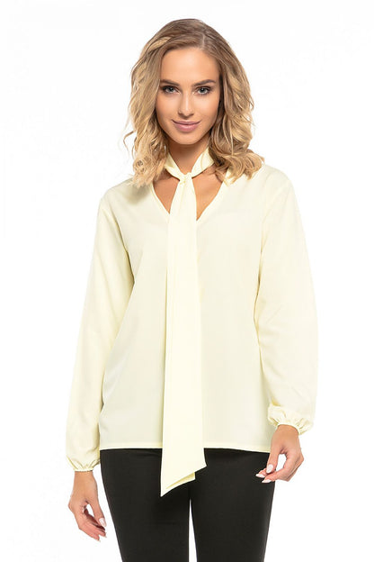 Elegant chiffon blouse by Tessita featuring a deep neckline and elastic sleeves, perfect for sophisticated styling.