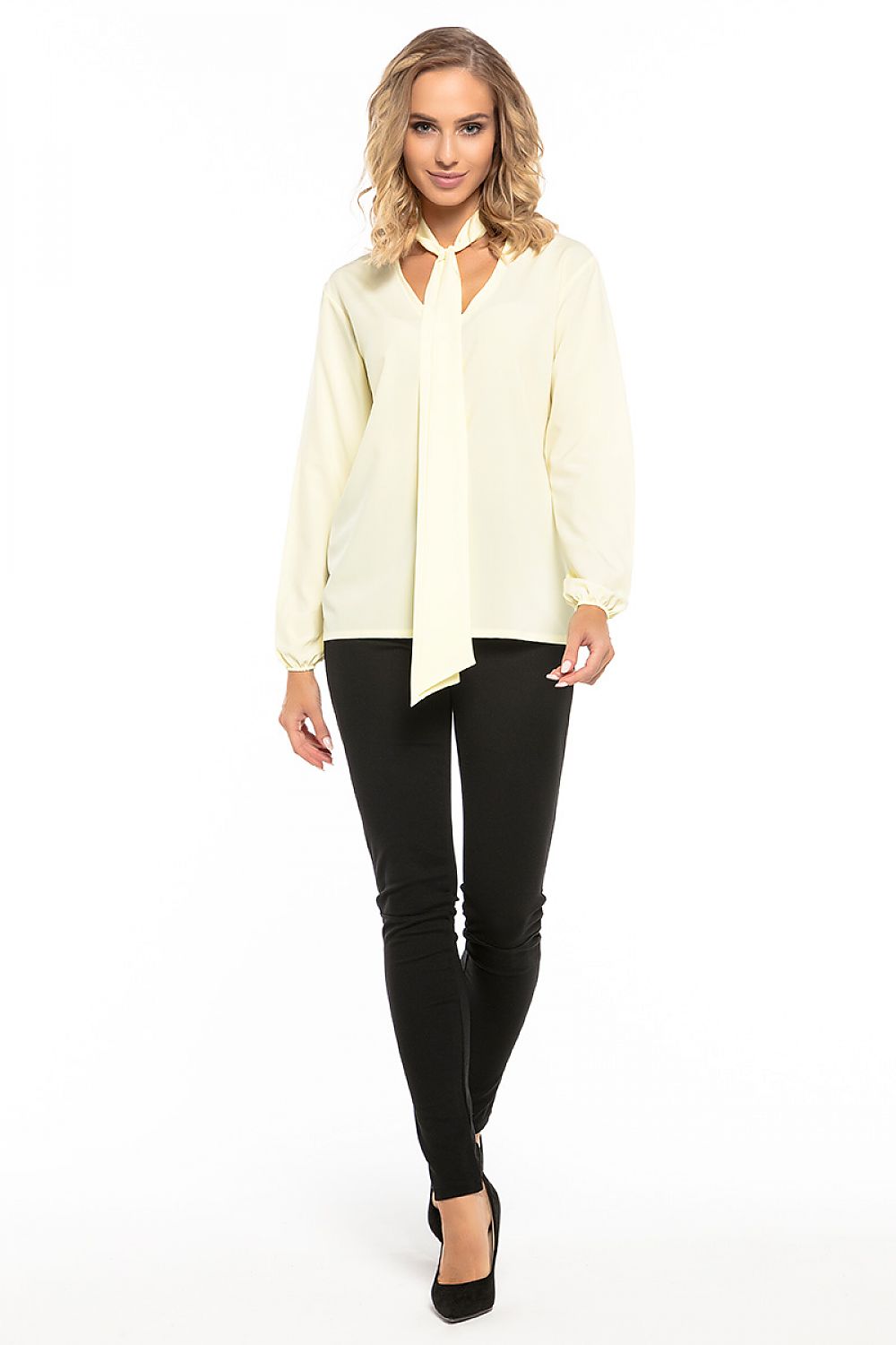 Close-up of Tessita's elegant chiffon blouse showcasing the luxurious fabric and intricate tie detail.