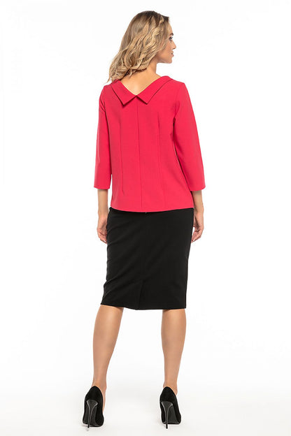 Model wearing the Tessita Jackie Kennedy style blouse, elegantly paired with tailored trousers for a chic ensemble.