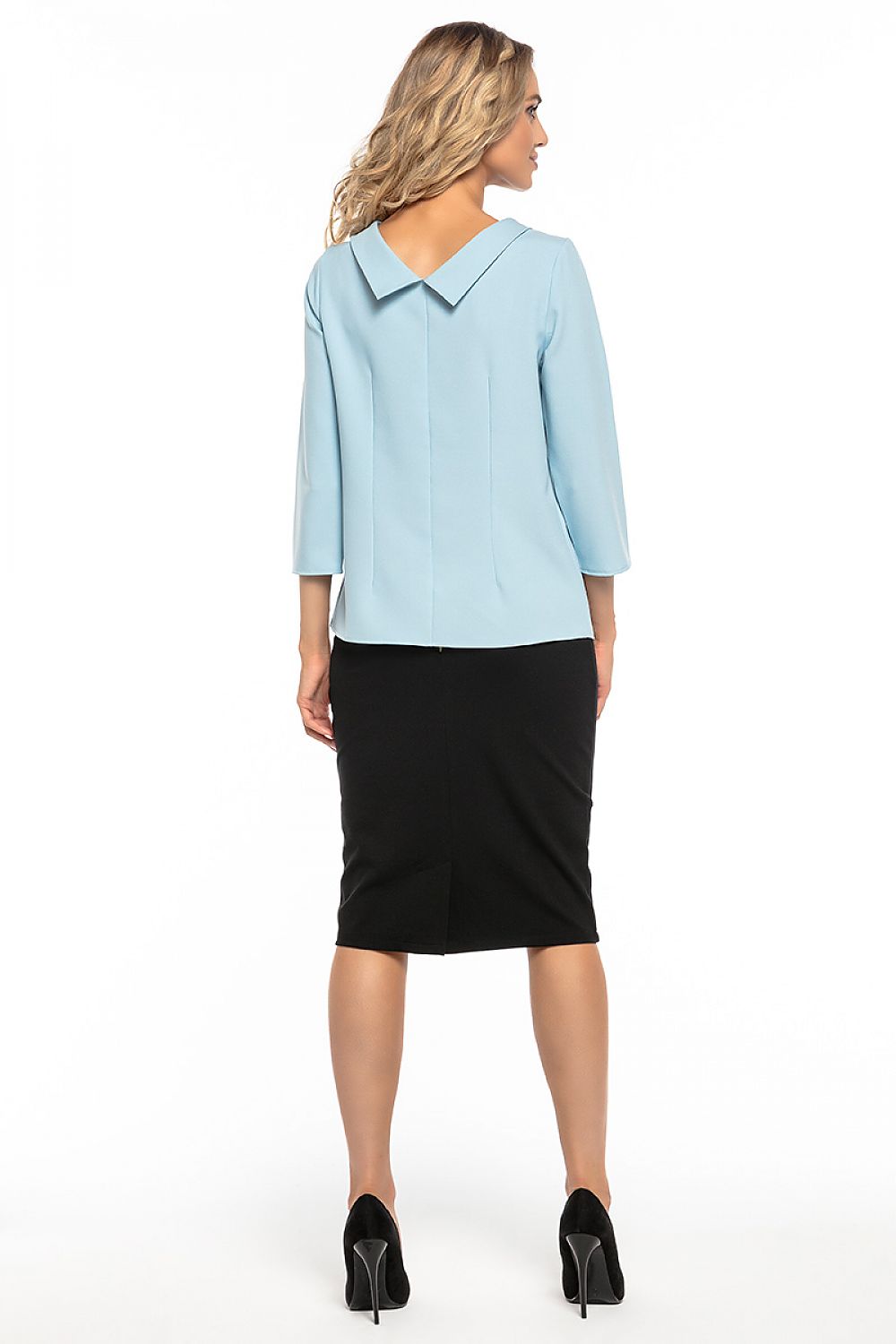 Elegant Jackie Kennedy style blouse by Tessita, showcasing sophisticated collar design and refined fabric in a luxurious setting.