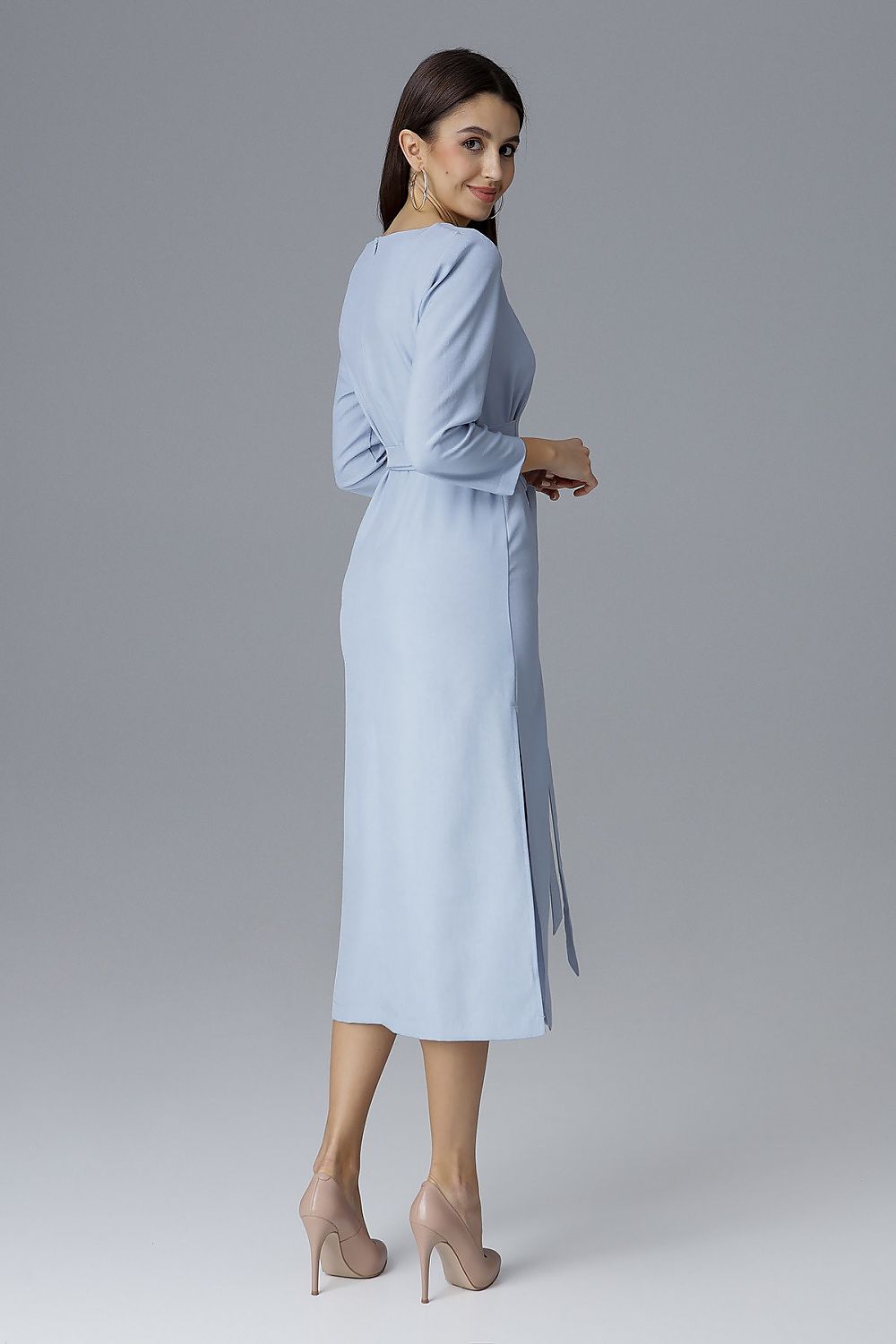 Luxurious Figl Cocktail Dress displayed against a refined backdrop, highlighting the elegant side slits and flattering waist tie for a chic ensemble.