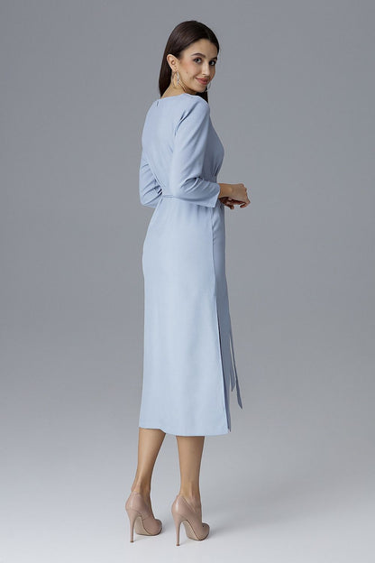 Luxurious Figl Cocktail Dress displayed against a refined backdrop, highlighting the elegant side slits and flattering waist tie for a chic ensemble.