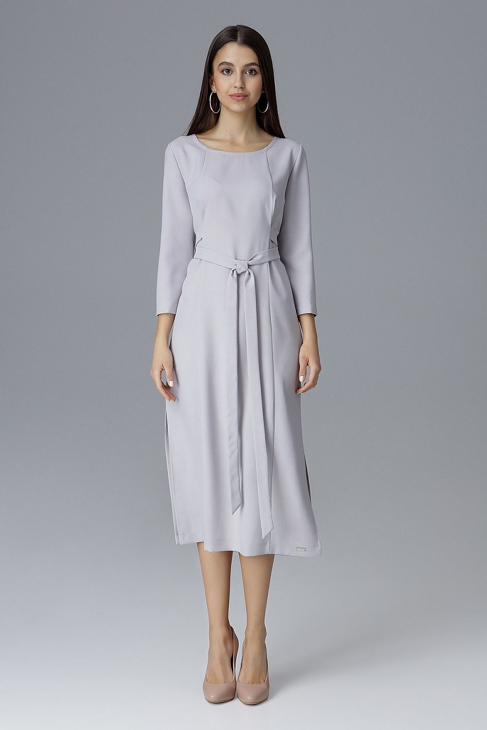 Chic Figl dress with exquisite topstitching, designed to enhance the silhouette beautifully with a stylish waist tie.