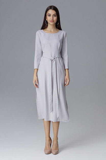 Chic Figl dress with exquisite topstitching, designed to enhance the silhouette beautifully with a stylish waist tie.