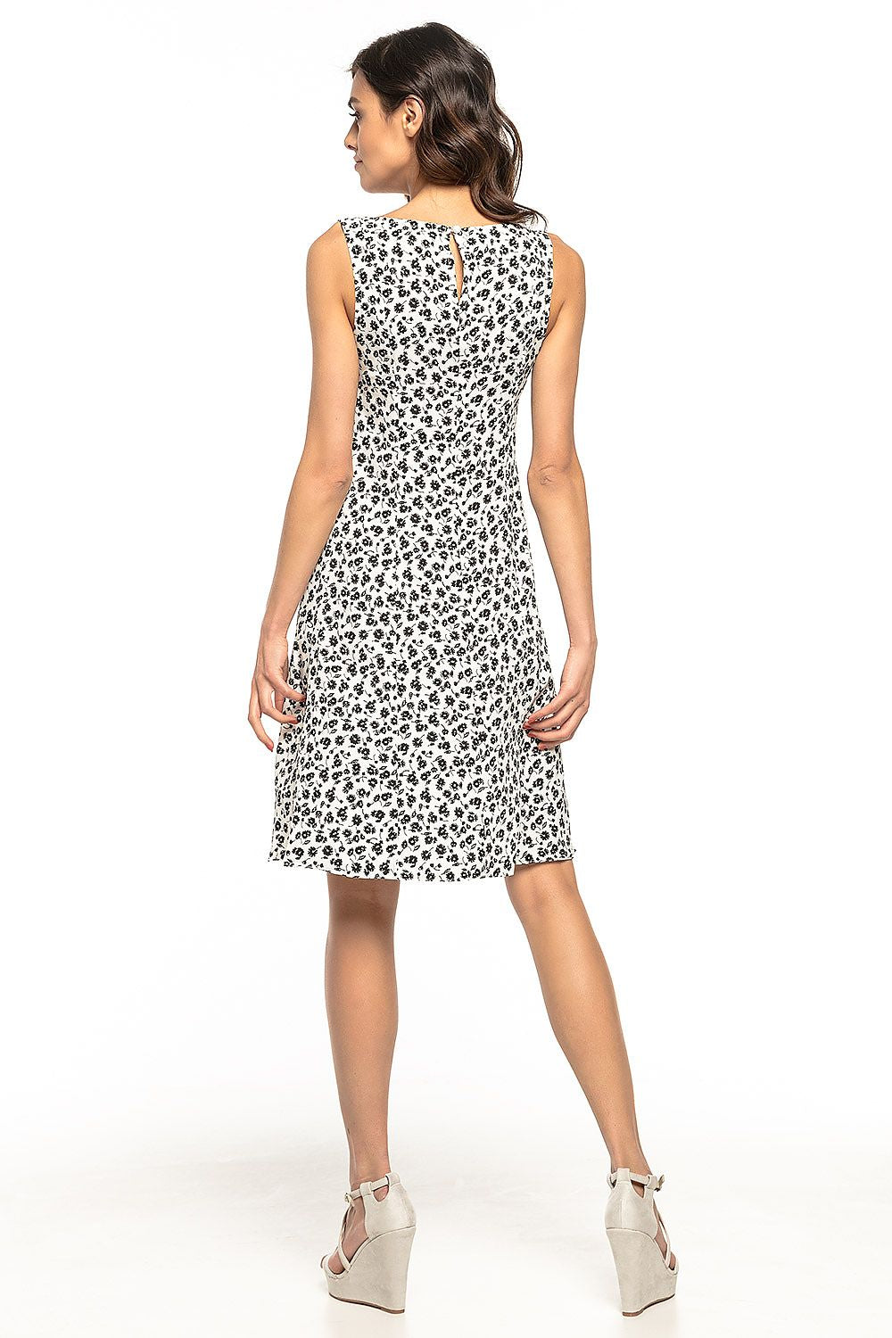 Model wearing the Elegant Floral Daydress by Tessita, exuding elegance and comfort in a summer setting.