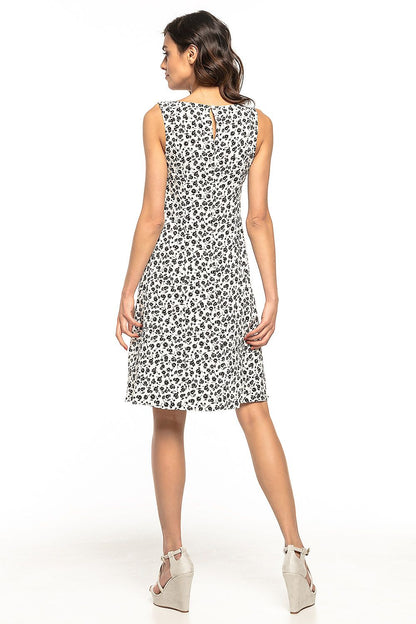 Model wearing the Elegant Floral Daydress by Tessita, exuding elegance and comfort in a summer setting.