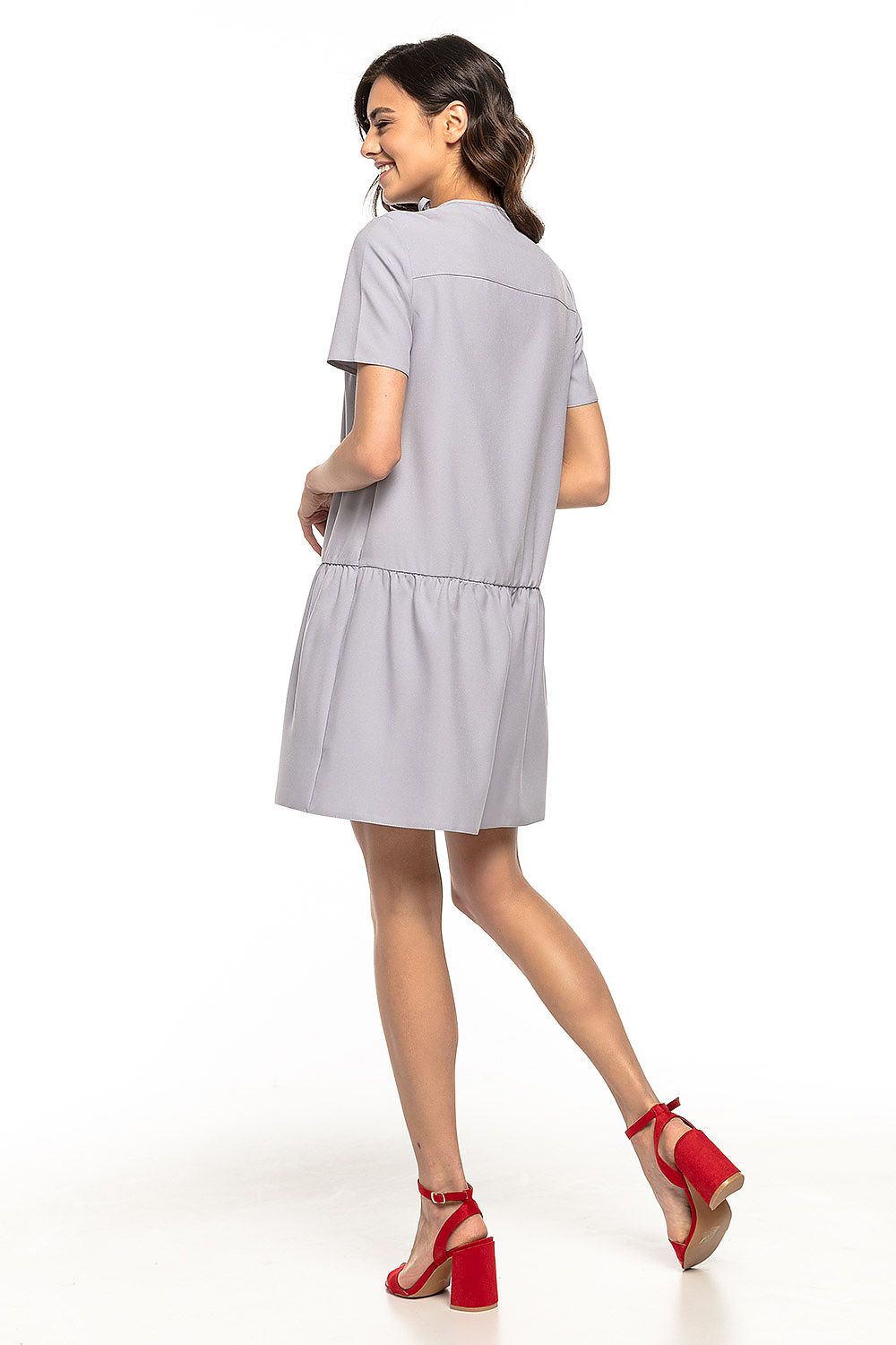 Elegant Tessita Summer Daydress featuring a charming ruffle and neck tie, perfect for luxurious holidays.