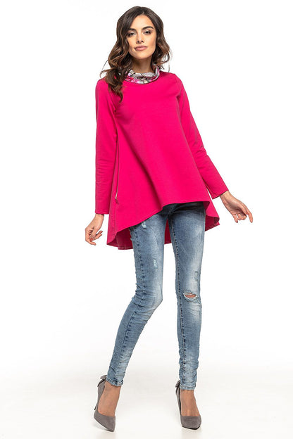 Detailed view of Tessita's luxury tunic showcasing its delicate floral pattern on the turtleneck and side seam pockets.