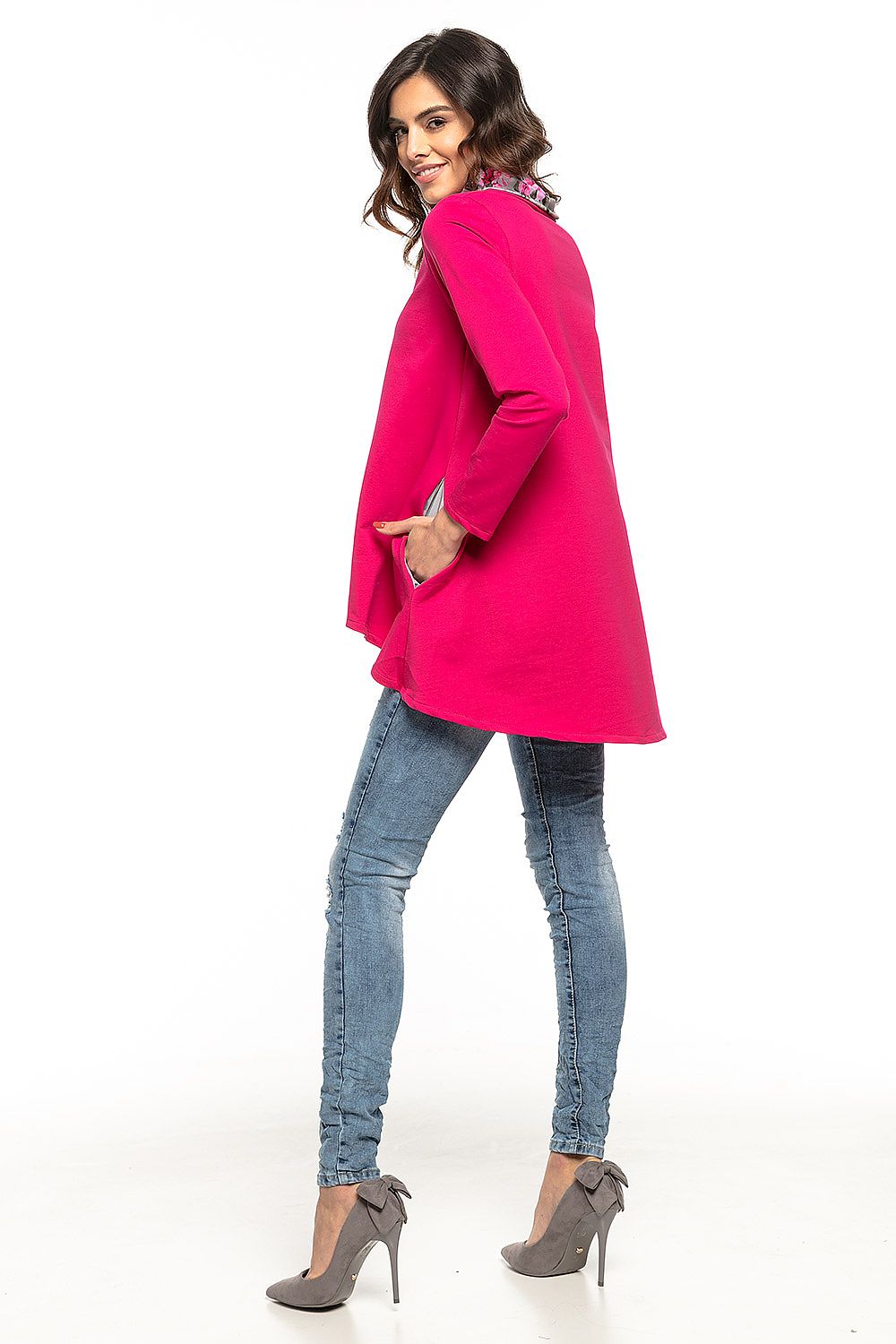 Stylish model wearing a Tessita luxury tunic with an extended back and floral turtleneck, ideal for casual chic outfits.