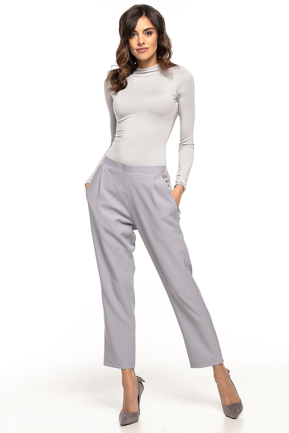 Close-up view of Tessita women's cigarette trousers showcasing the fine texture and tailored fit, ideal for upscale fashion.