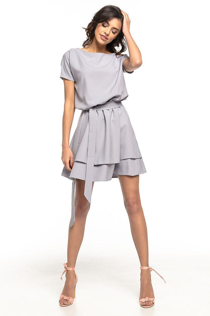 Elegant Tessita daydress featuring a double skirt and waist belt in kimono style, perfect for special occasions
