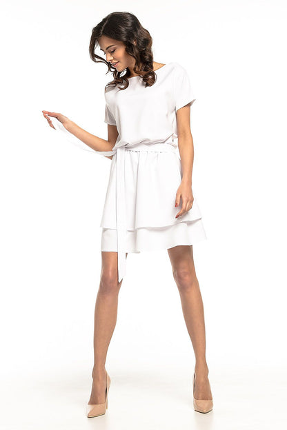 Side view of the Tessita Daydress showcasing the luxurious kimono-inspired design and flared double skirt.