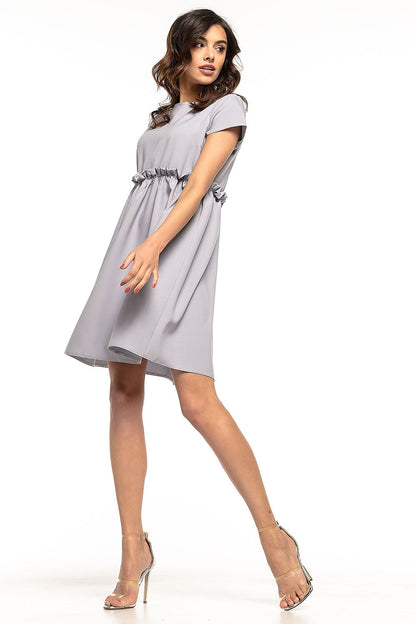 Elegant Tessita daydress featuring a delicate frill and yoke design, perfect for stylish everyday wear and special occasions.