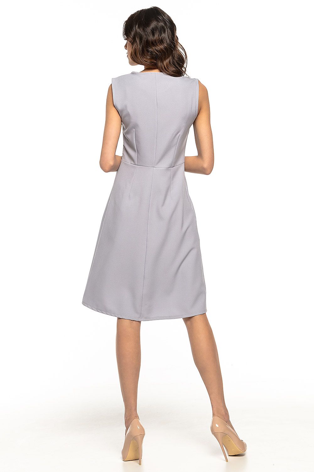 Full view of the Tessita Daydress in a graceful silhouette, showcasing its sophisticated trapezoidal hem and covered zipper, ideal for elegant work attire or casual outings.