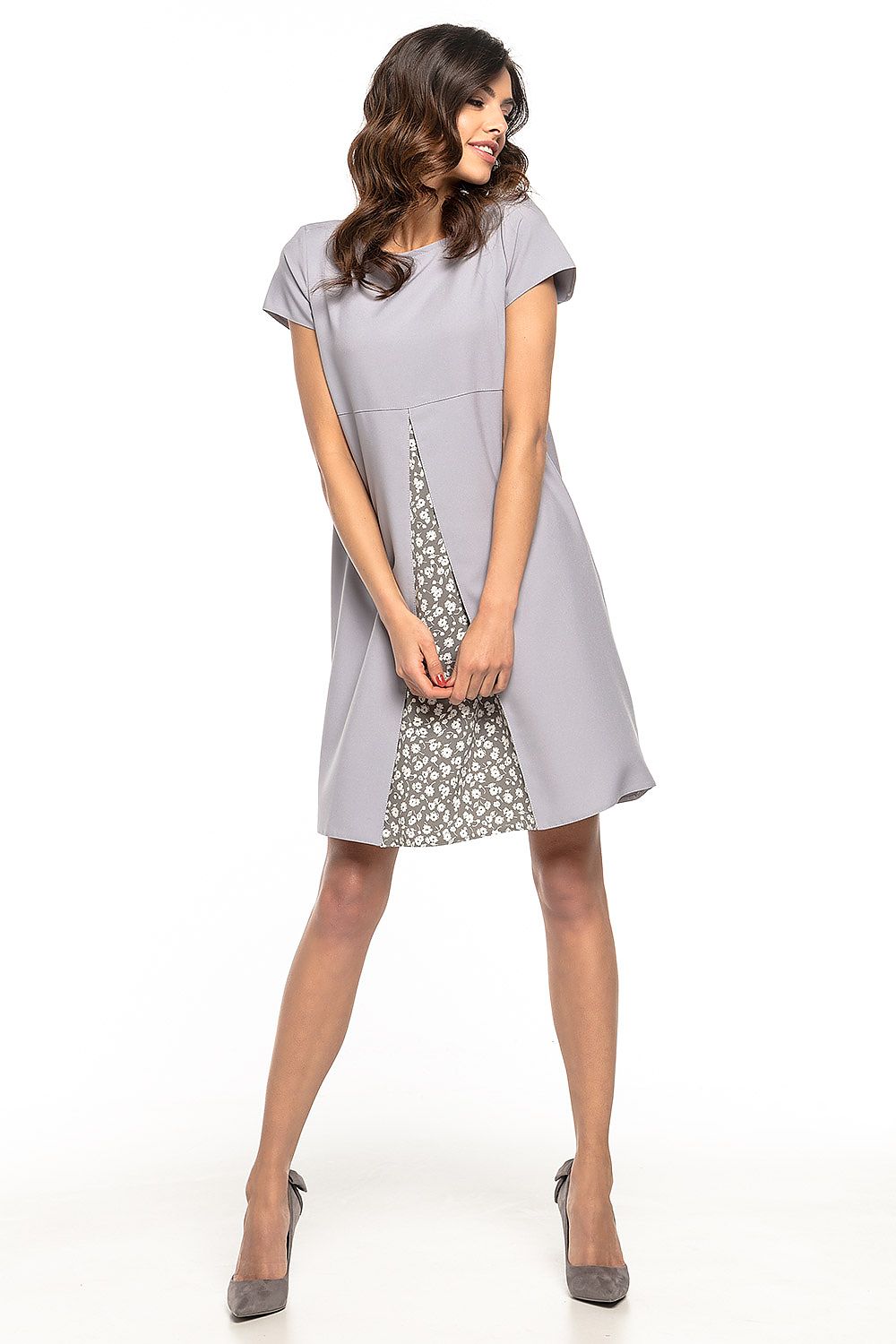 Elegant floral pattern woven daydress by Tessita, showcasing a stylish counter-fold design and vibrant floral prints, perfect for all occasions.