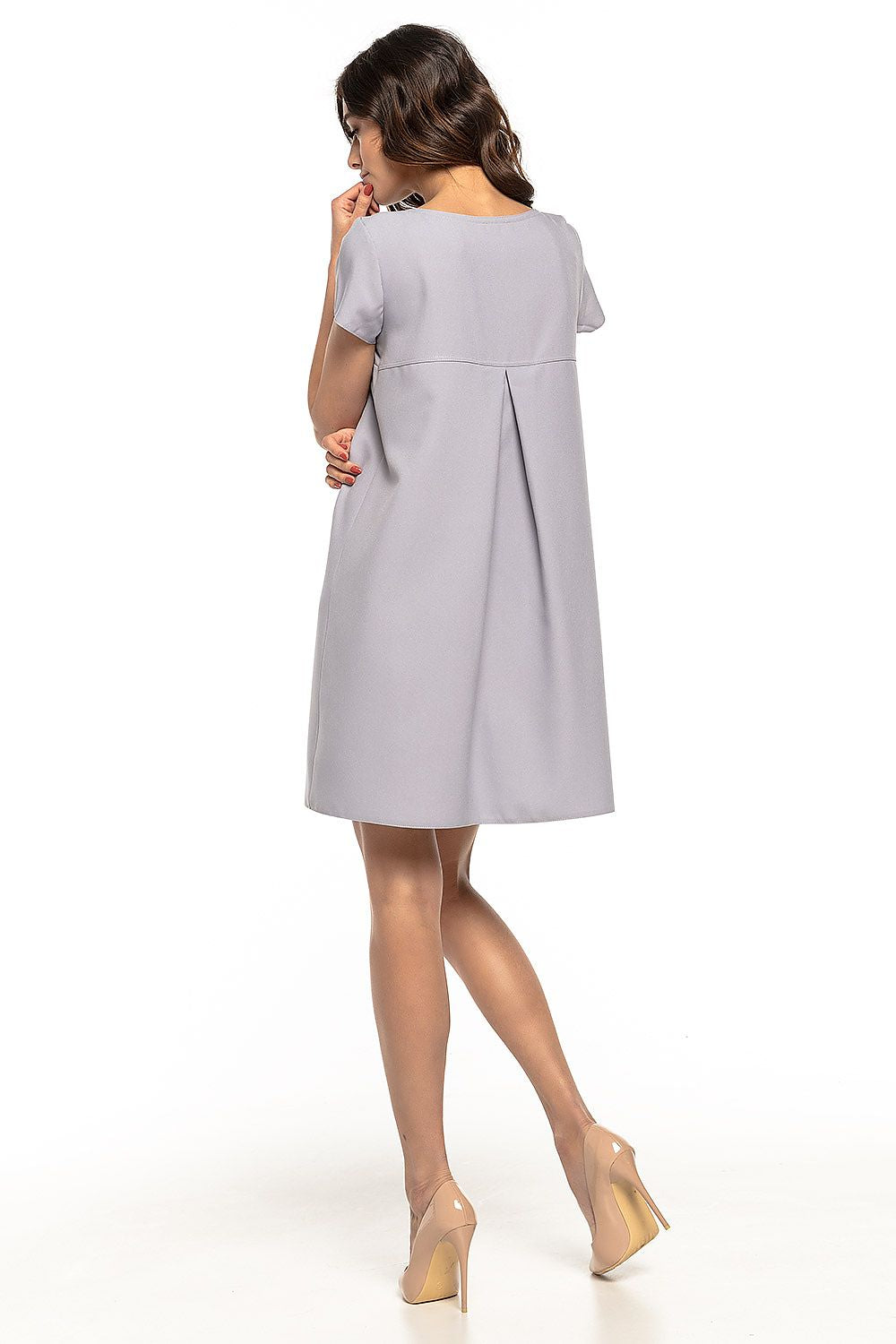 Chic loose-fit dress by Tessita, elegantly designed with a ruffled back, making it a versatile choice for any stylish woman's wardrobe.