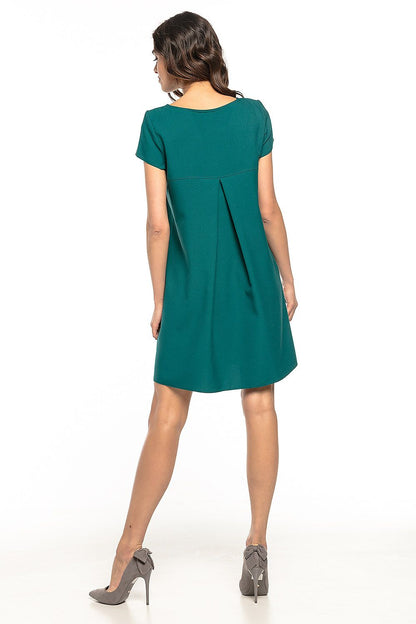 Elegant Tessita daydress featuring a charming ruffled back, perfect for a feminine style on any occasion.