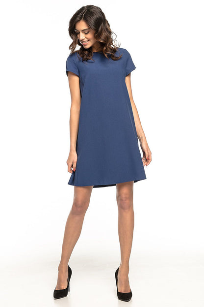 Tessita loose-fit daydress showcasing delicate ruffles, ideal for effortless elegance and comfort.