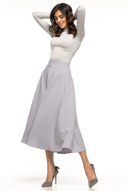 Versatile Tessita midi skirt ideal for both casual and formal occasions, embodying elegance and sophistication.
