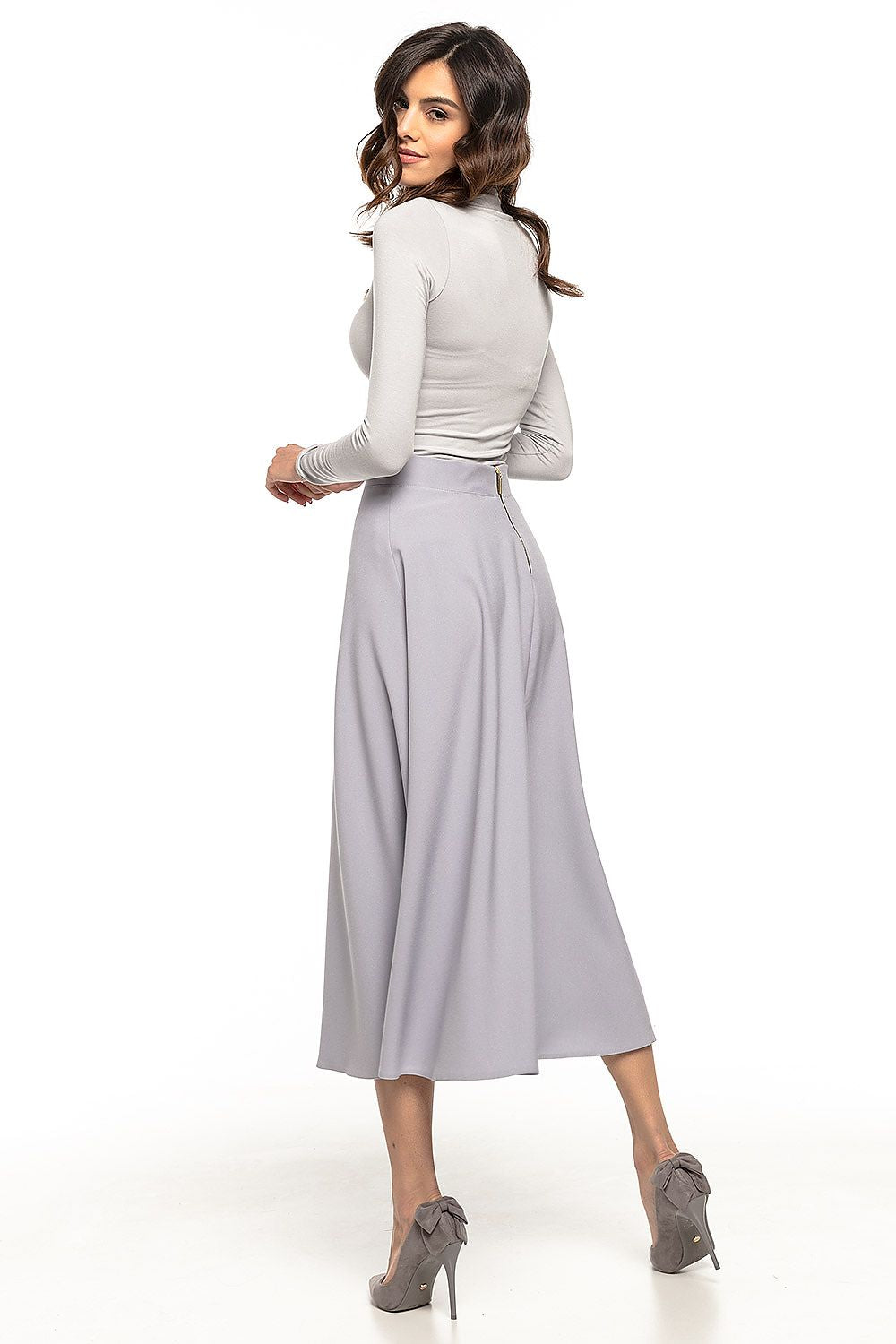 Tessita's stunning 50s inspired midi skirt, featuring a flowing design that enhances graceful movement.