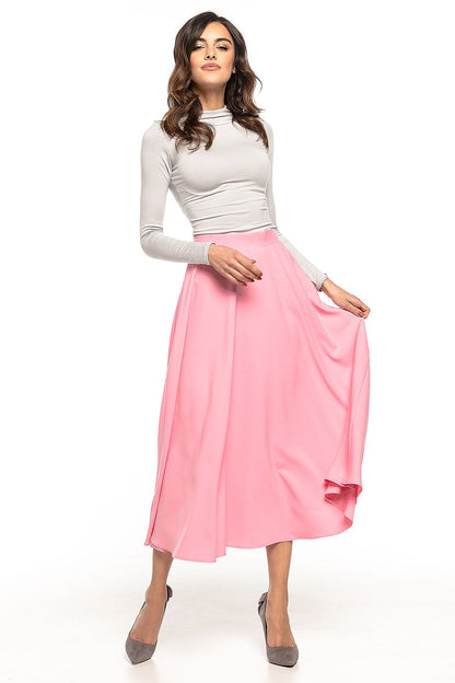 Tessita elegant 50s inspired midi skirt showcasing beautiful fabric and flowing motion, perfect for stylish casual or formal occasions.