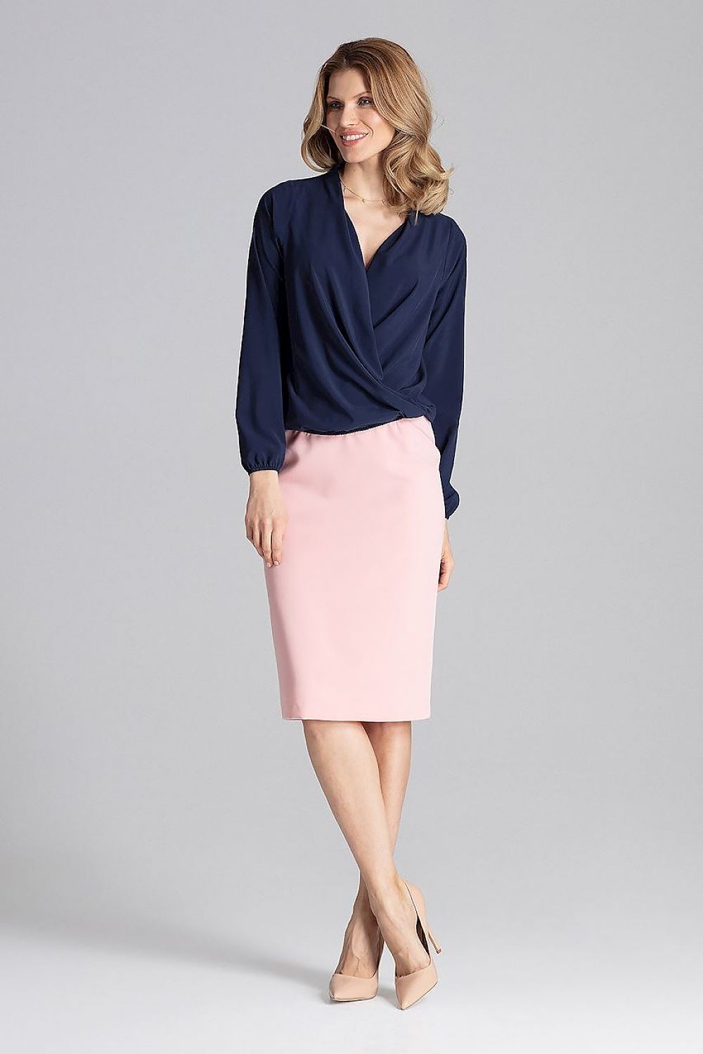 Model wearing the Elegant Figl Blouse With Envelope Neckline And Elastic Finish, demonstrating its versatile styling for both casual and formal occasions.