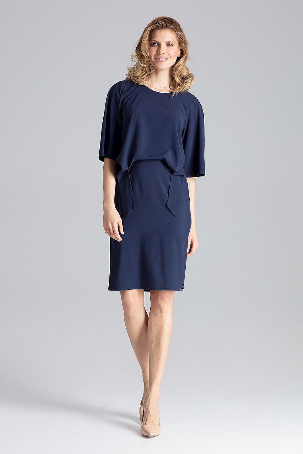 The Elegant Knee-Length Daydress by Figl showcasing its flattering elastic waist and loose reglan sleeves.