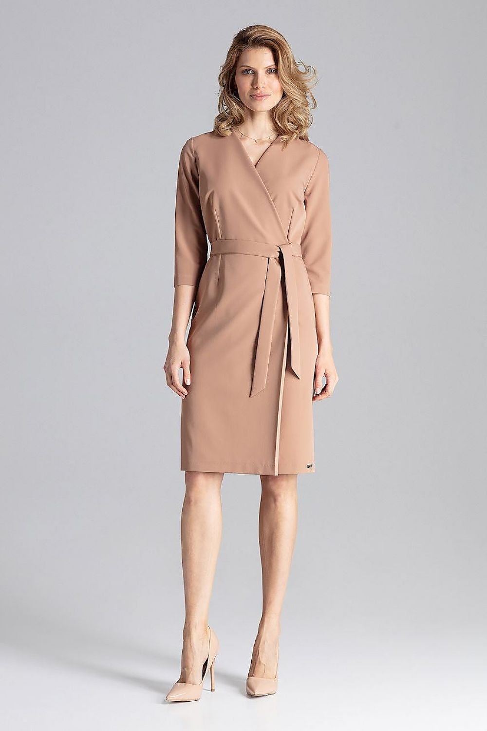 Model wearing the Elegant Figl Daydress With Envelope Neckline, illustrating its versatility for both formal and casual occasions.