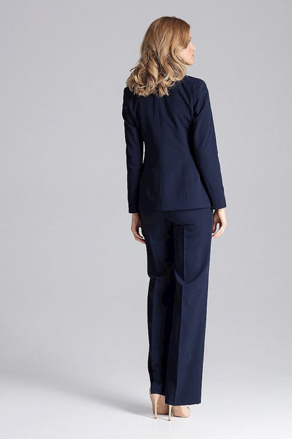 Model wearing Elegant Figl One-Button Jacket with decorative colourful lining, showcasing its elegance and flattering fit in an upscale setting.