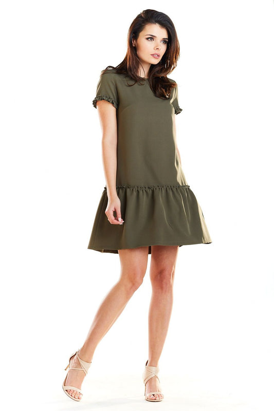 Elegant Mini Daydress by Awama featuring a trendy cutaway skirt design, perfect for all skin tones.