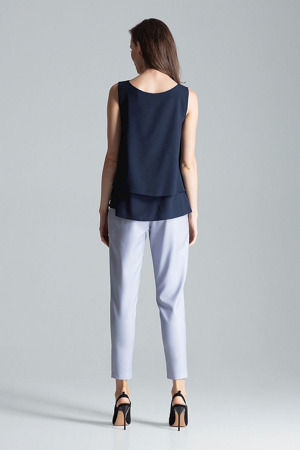 Flared bottom detail of Blouse Figl, enhancing the luxurious silhouette for a chic look.