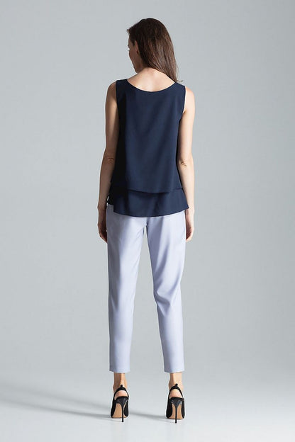 Flared bottom detail of Blouse Figl, enhancing the luxurious silhouette for a chic look.