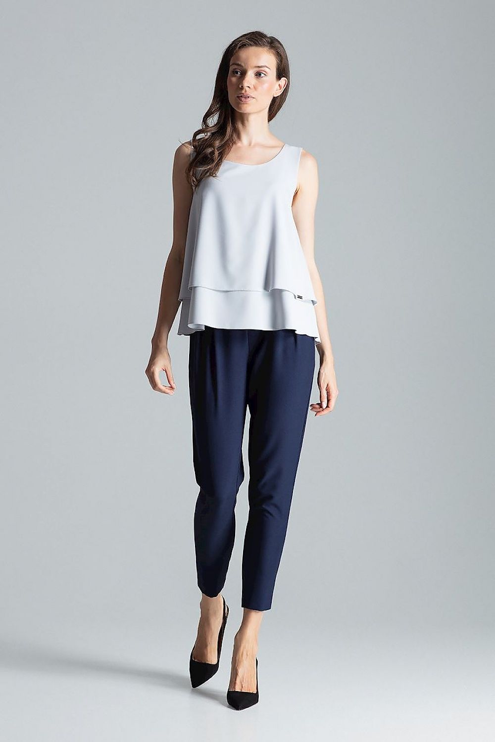 Luxury fashion detail of the Blouse Figl, highlighting its fit and elegance.