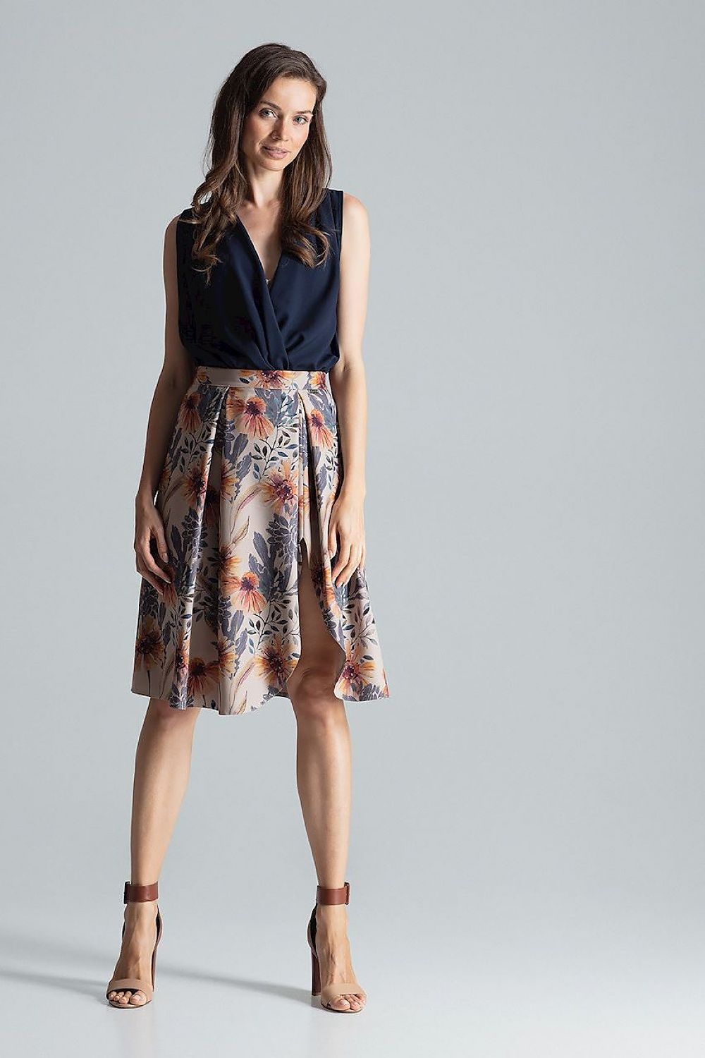 Model wearing the Elegant Burgundy Midi Skirt With Asymmetrical Slit by Figl, perfect for formal occasions and evening elegance.