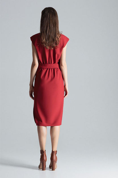 Stylish burgundy midi dress by Figl showcasing a flattering v-neck, ornate waist belt, and chic asymmetrical slit.