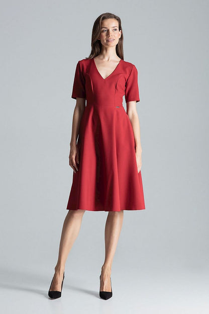 Stylish maroon midi dress with short sleeves and flared skirt by Figl, featuring elegant side pockets for added sophistication.