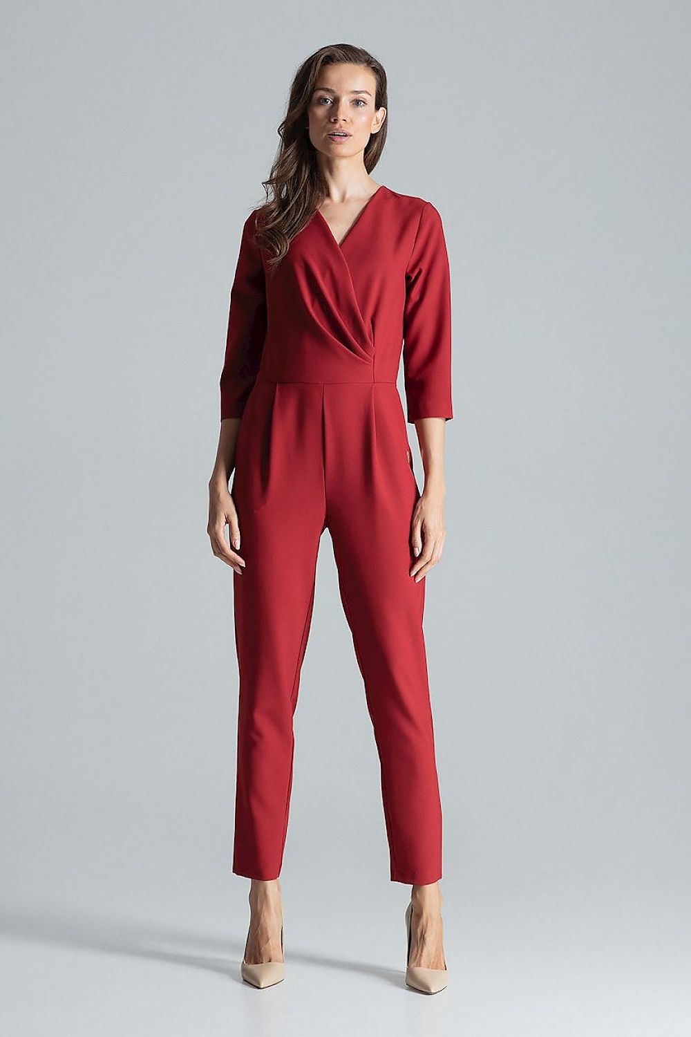Side slanted pockets on the luxurious maroon jumpsuit with envelope neckline by Figl, adding practicality to chic fashion.