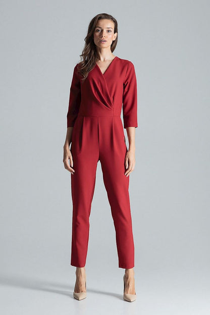 Side slanted pockets on the luxurious maroon jumpsuit with envelope neckline by Figl, adding practicality to chic fashion.