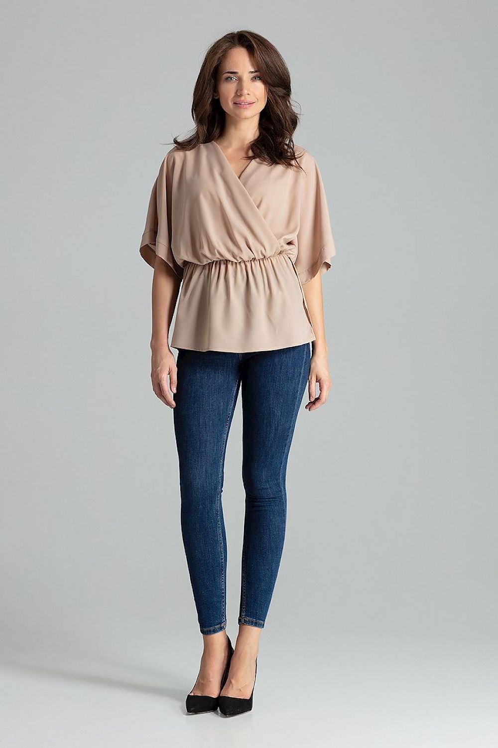Elegant casual top, Lenitif Beige Loose-Fitting Blouse with Kimono Sleeves and Waist Elastic, displayed on a mannequin in a luxurious setting.
