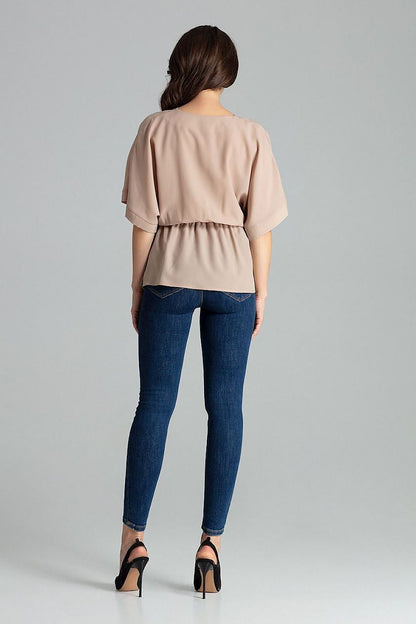 Close-up of the detailed kimono sleeves of the Lenitif Beige Loose-Fitting Blouse, emphasising its elegant design and quality fabric.