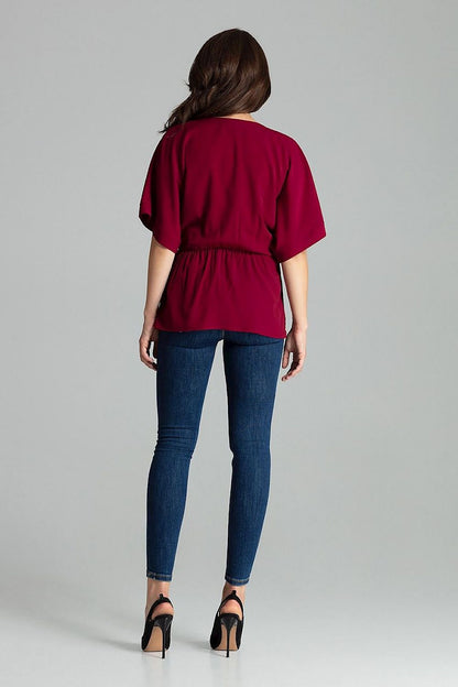 Lenitif Beige Loose-Fitting Blouse elegantly styled in a chic environment, perfect for a fashionable casual outing.