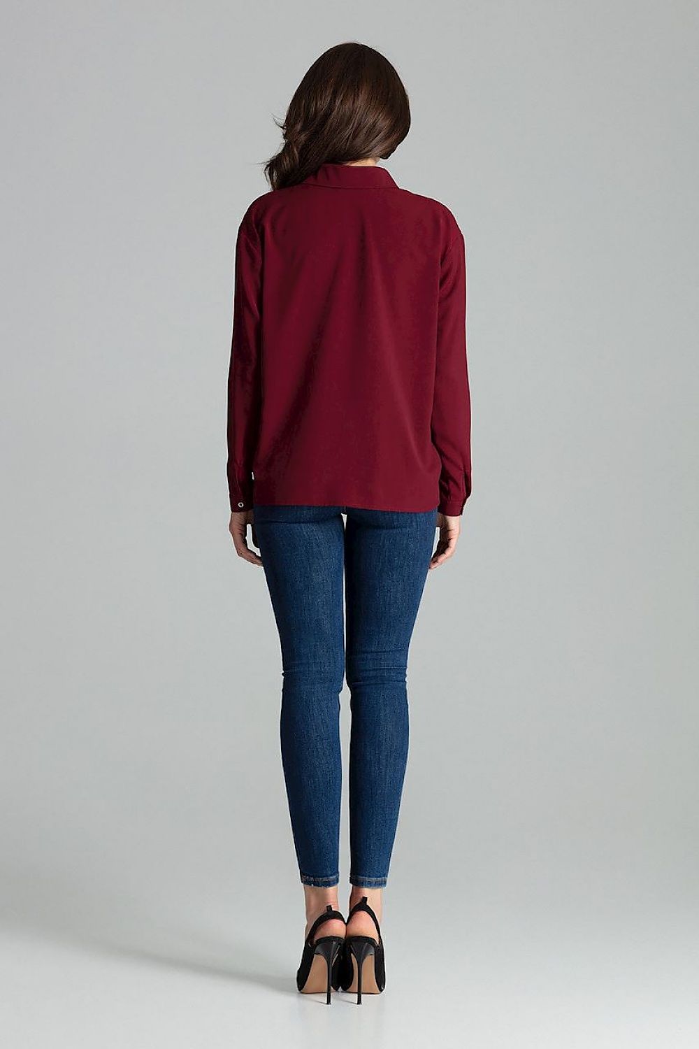 Elegant styling of Lenitif Long Sleeve Button-Up Shirt with Pocket, designed for a refined wardrobe.