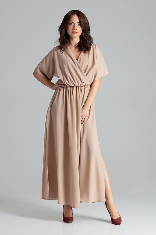 Elegant Lenitif beige long dress with kimono sleeves and side slits, showcasing a luxurious flared design.