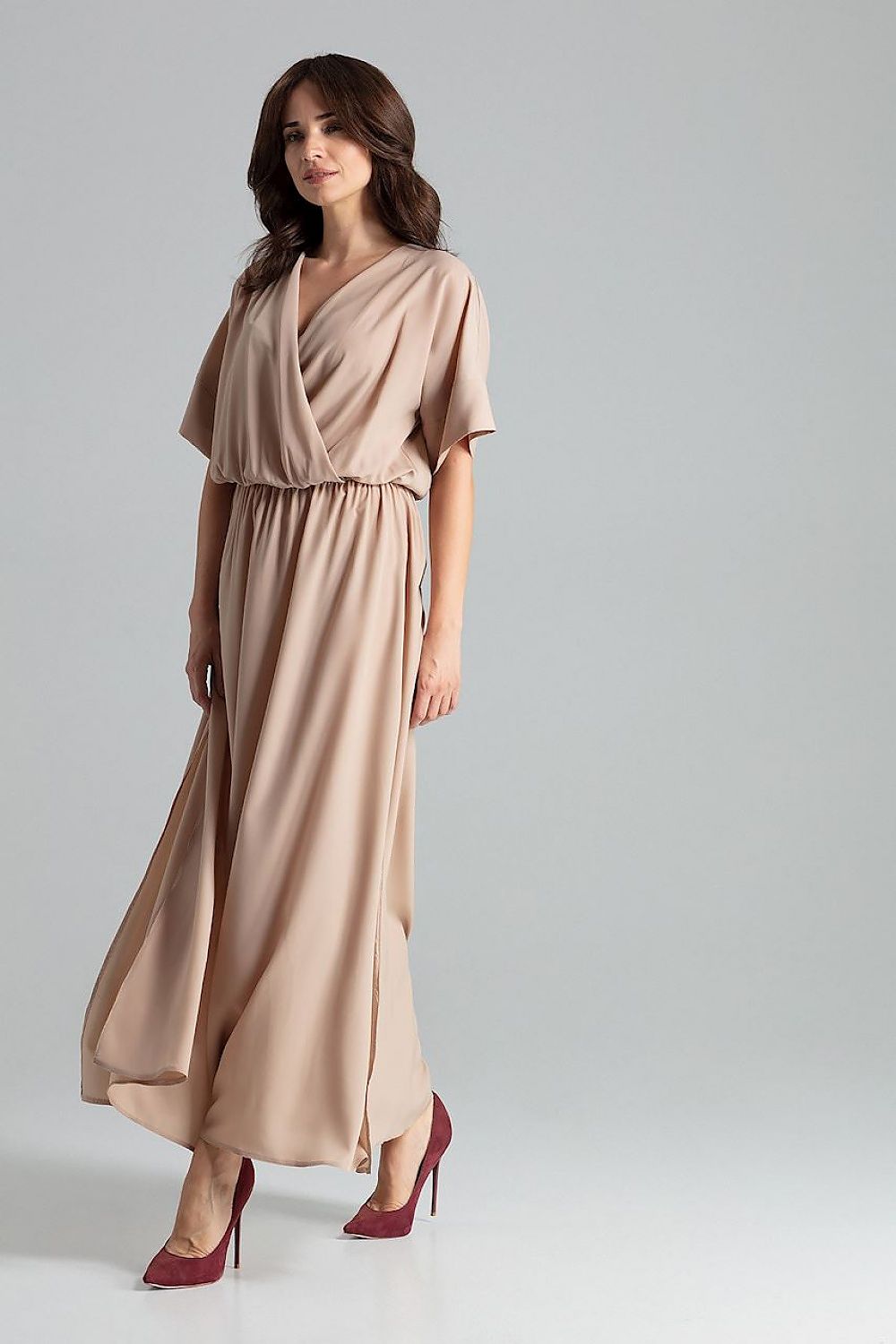 Sophisticated detail of Lenitif beige long dress with cuffed kimono sleeves and flattering side slits.