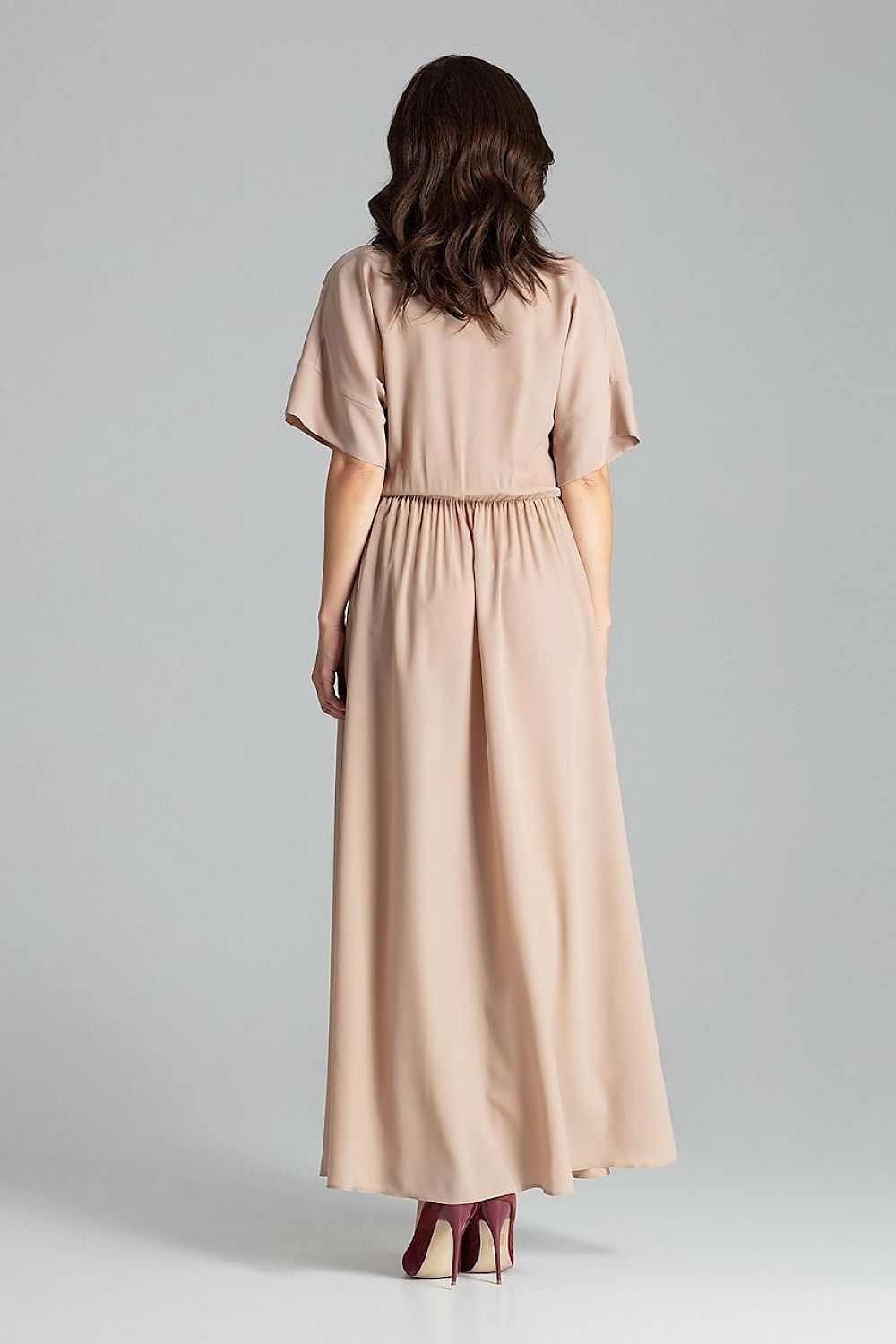 Chic length of Lenitif beige long dress featuring a beautiful envelope neckline and side slits for elegance.