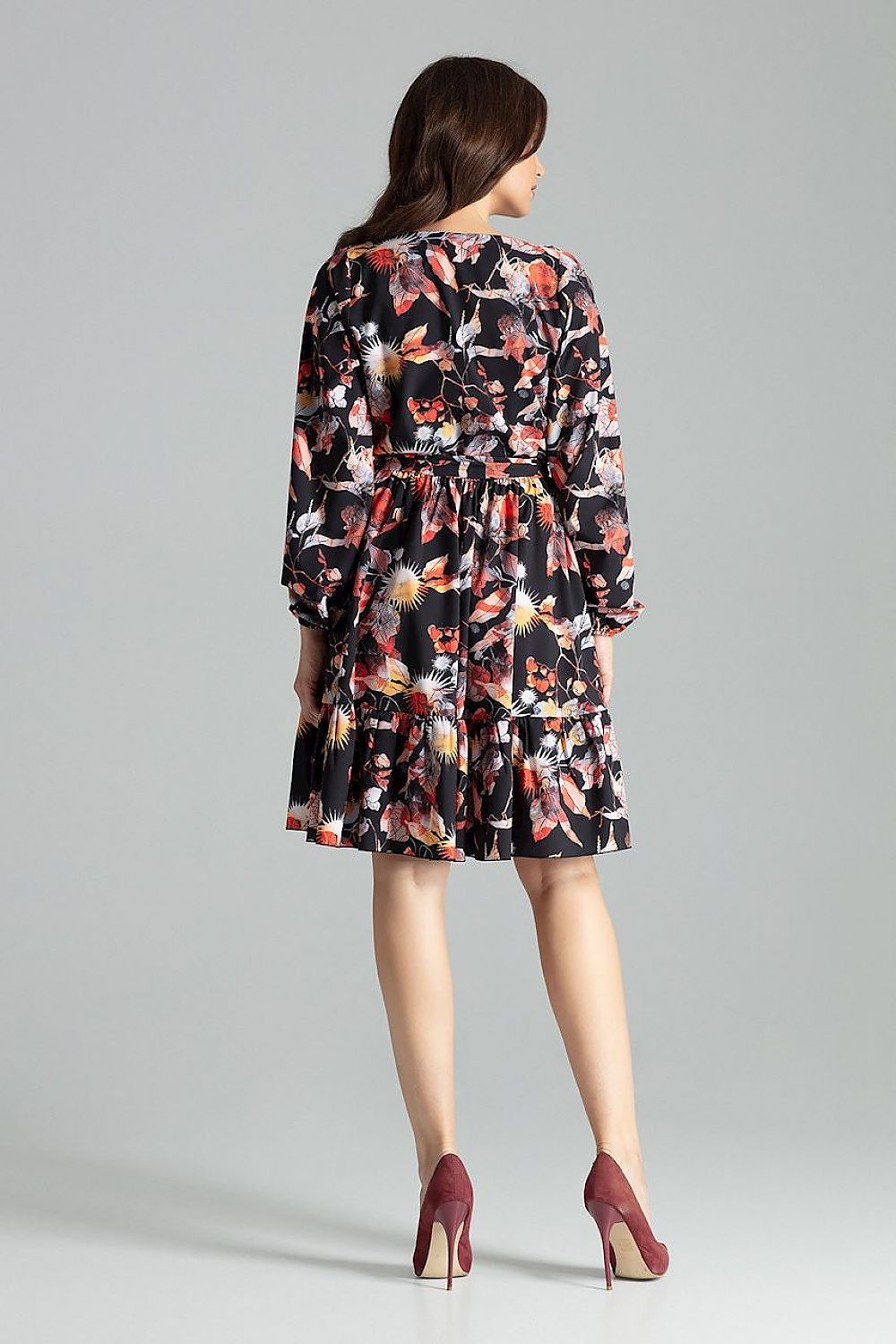 Elegant Beige Midi Dress with Long Sleeves, Ruffle Hem and Sash Tie by Lenitif - Model demonstration of the dress in a chic styling context.