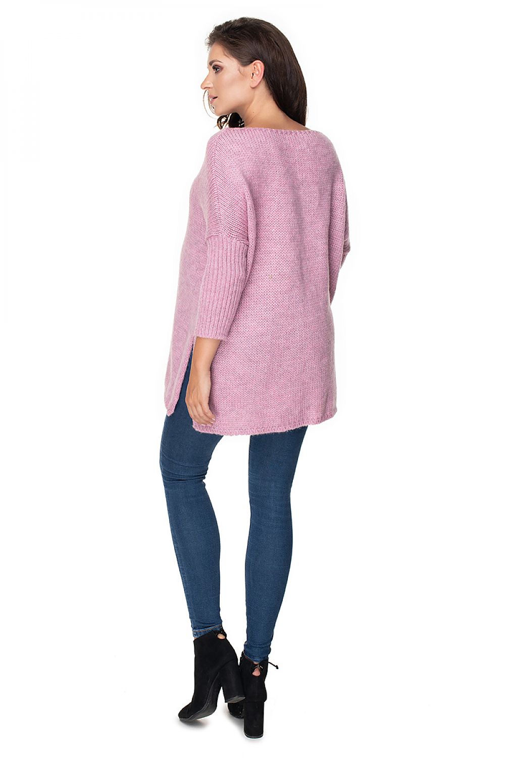Elegant side view of the PeeKaBoo luxury loose-fitting pregnancy sweater, featuring long sleeves and slits for added comfort and style.