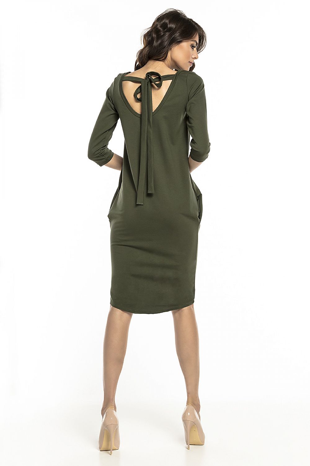 Back view of an elegant olive green tuba dress with a unique tie detail, designed by Tessita, highlighting its modern and stylish appeal.